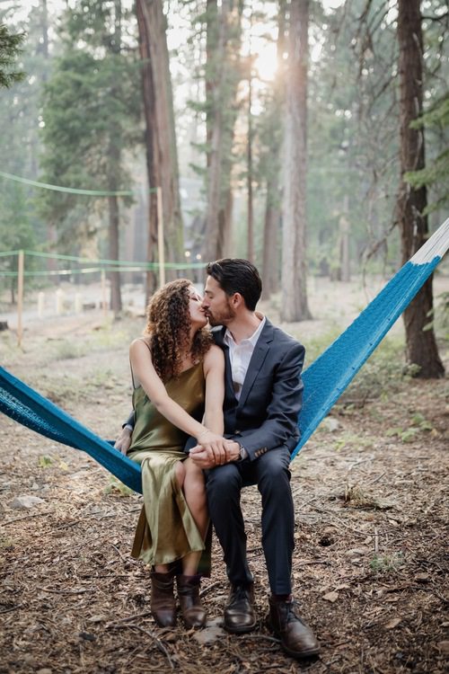 Couple kissing in a hammock